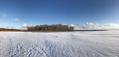 winter  lake shore panorama, blue sky sunny day landscape