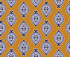 Ornamental decorative floral blue motif seamless pattern design. Mustard background. Great for fabric and textile, wallpaper, packaging or any desired idea.