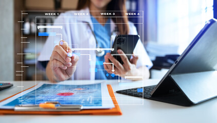 Project manager working and update tasks with Gantt chart scheduling diagram at hospital .success smart medical doctor working with smart medical doctor .