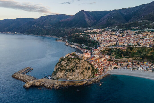 Aerial view of Scilla, a small town along the Mediterranean Sea coastline at sunset, Reggio Calabria, Calabria, Italy.