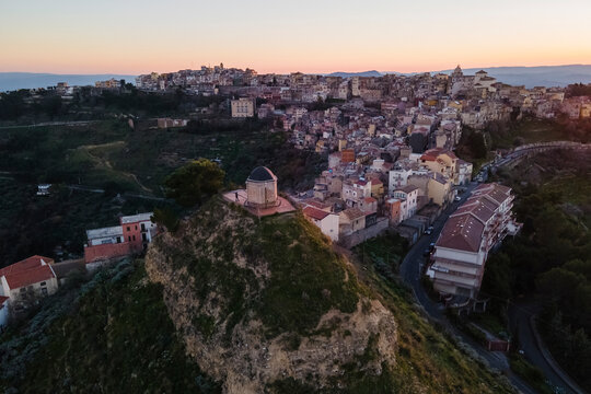 Aerial view of a small church on Monte Calvario in Centuripe small town at sunset, Enna, Sicily, Italy.