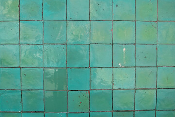 Green tile bathroom wall texture, old vintage colorful kitchen floor background