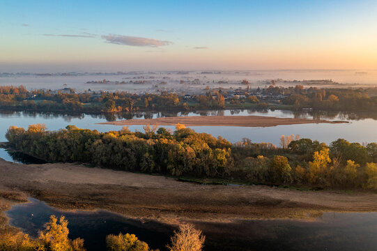 Aerial view of Loire river with sandbanks at sunset in Gennes, Maine-et-Loire, France.