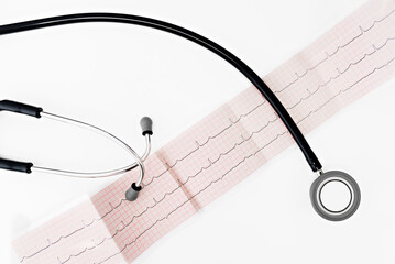 Stethoscope and cardiogram or ekg on white background. Stethoscope on cardiogram on a white...