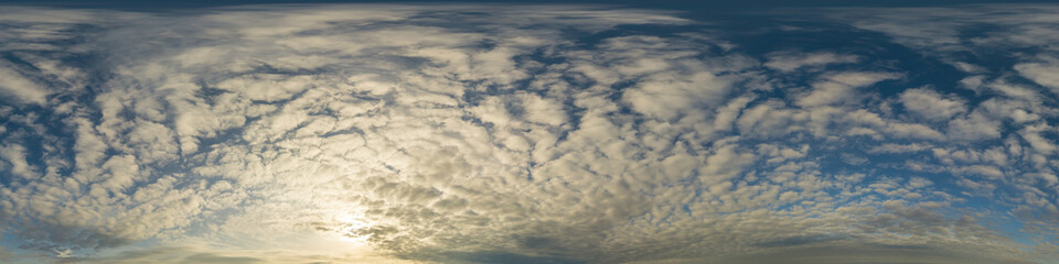 Panorama of a dark blue sunset sky with golden Cumulus clouds. Seamless hdr 360 panorama in spherical equiangular format. Full zenith for 3D visualization, sky replacement for aerial drone panoramas.