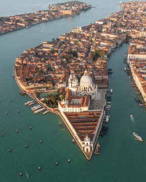 Aerial view of Santa Maria della Salute church along the lagoon in Venice, Veneto, Italy.