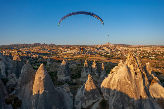 Aerial view of a person flying the paramotor in Cappadocia, Turkey.