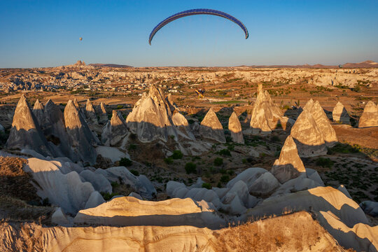 Aerial view of a person flying the paramotor in Cappadocia, Turkey.