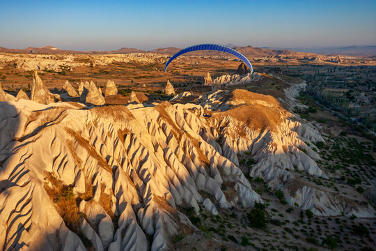 Aerial view of a person flying the paramotor in Cappadocia, Turkey.