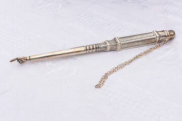 A silver Torah pointer, also known as a hand or a finger or a 