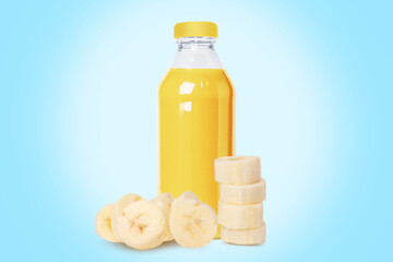 Bottle of fresh banana juice, nectar. A set of banana slices. On a blue background.
