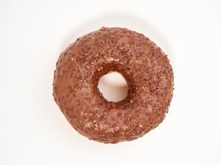 Chocolate donut with chocolate chips on a white background. close-up.