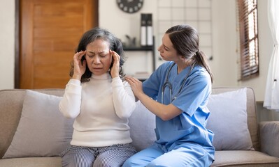 Fototapeta premium Female nurse visit old grandmother patient at home listen to complains concerns, attentive young woman doctor consulting mature senior grandma, elderly medical healthcare concept