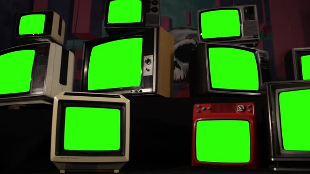 Pile of Vintage Televisions with Green Screens, Zoom In Shot