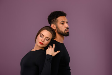 Portrait of young multiracial couple, studio shoot.