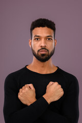 Portrait of young multiracial man in studio.