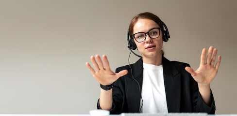 Online psychologist consultation woman in headset and glasses video call looking.
