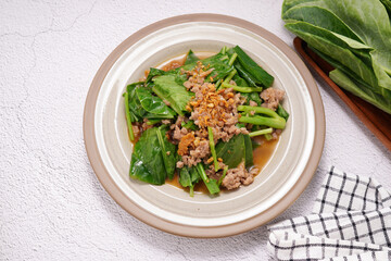 Stir-fried kale on a cup on a white stick
