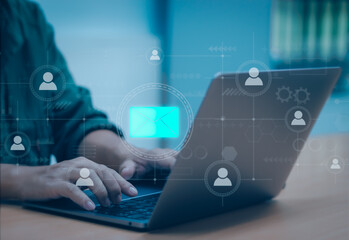 Email marketing technology concept, male hand typing on laptop keyboard with envelope icon Chat or communicate via email messaging between buyers and sellers, online marketing