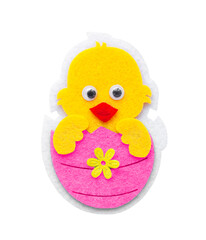 - Easter concept, an ornamental chicken hatched from a pink Easter egg, in isolation. High quality photo