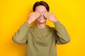 Photo of funky crazy man wear quality clothes hiding eyes playing game isolated on yellow color background