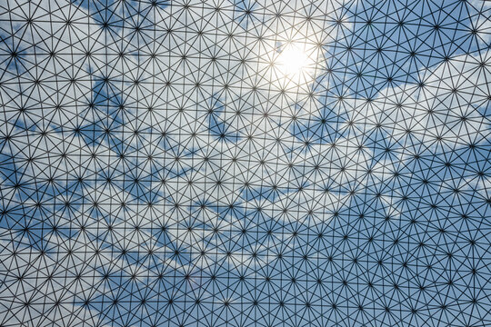 Montreal, Canada - August 27, 2022: The sky seen through the Metallic Cell structure of Biosphere museum in Montreal