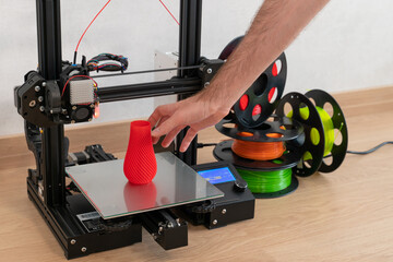 Modern 3D printer and multi-colored filament spools