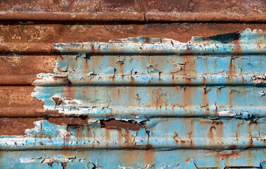 pattern rusty metal surface with remnants of blue paint