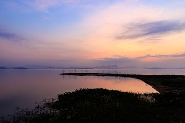 The landscape sunrise of the quiet lake in the dawn as the sunrise