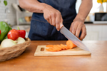 Man preparing food in kitchen at home.