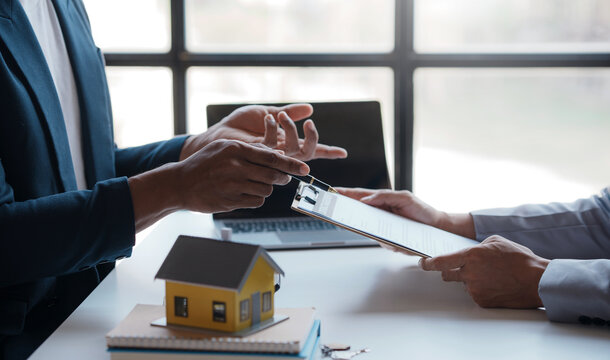 Real estate agent present house and land to their client by offering example of model home Introducing home loan loan, preliminary installment Offer idea for mortgage loan and home insurance.
