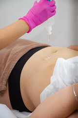 a girl in a beauty salon takes cosmetological procedures for the care and improvement of hair and skin