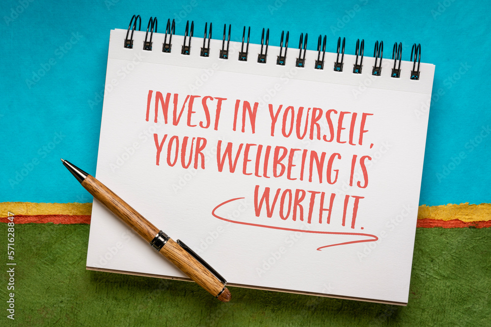 Poster Invest in yourself, your wellbeing is worth it. Inspirational writing in a notebook, self care concept.