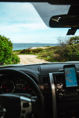 view from car front windshield at sea beach
