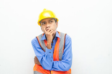 thoughtful asian male construction worker in pensive mood doing thinking and wondering gesture.