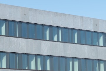 Fototapeta premium white and grey warehouse building with windows