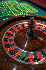 Roulette table and stack of poker chips - Casino, gambling concept