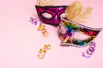 Festive mask for masquerade or carnival celebration on colored background