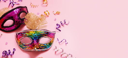 Festive masquerade or carnival background with festive masks with copy space