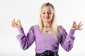 Happy woman wearing ribbed blouse standing isolated over white background mudra gesture and poses...