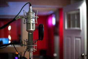 Detail of condenser microphone in music recording studio