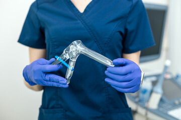 Gynecological instrument in the hands of a doctor