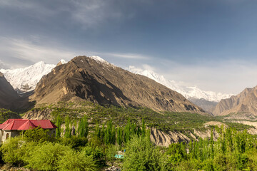 Panoramic view of Hunza Valley with brown and white lofty mountains 