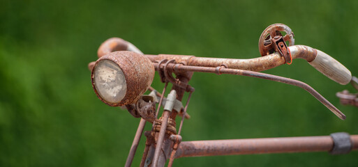 banner of Old decay bicycle on green vine climbing garden wall outdoor. Rust Classic bike old bicycle on green garden wall retro style. Vine plant green leaves partition background.