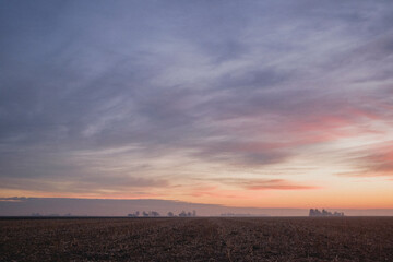 Sunset over an empty field