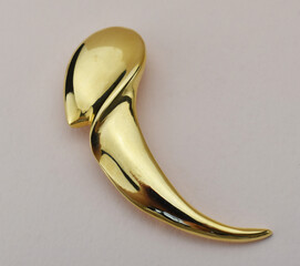 Old vintage brooch on beige background, accent retro jewelry for women