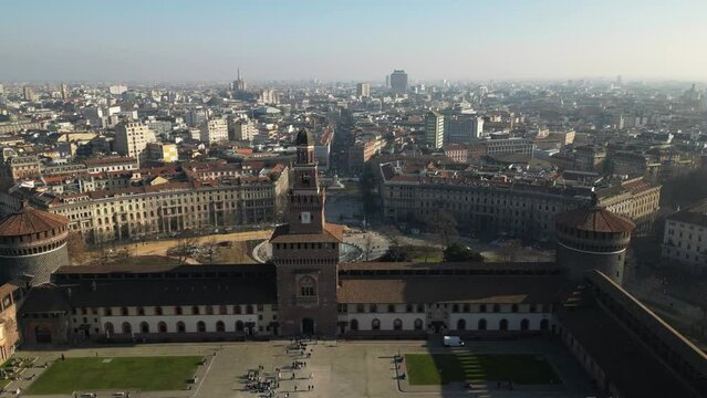 EUROPE, ITALY MILAN 2023 - Drone aerial view  from Sforza Castle in Sempione park with skyline of the city in downtown - Via Dante and Duomo cathedral 