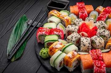 Big set of Asian food. Sushi and rolls on a dark background. © white78