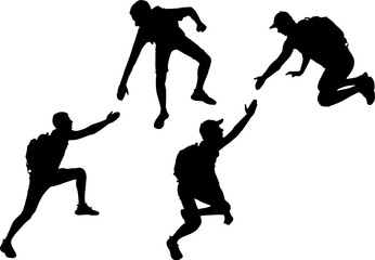 Silhouette of a male climber offering a helping hand to his partner. Business Concept
