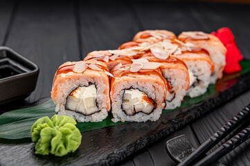 Sushi rolls with grilled salmon and pear.